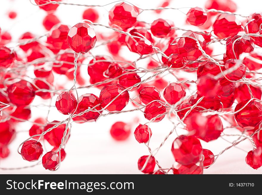 A chain  with red jewels isolated on white. A chain  with red jewels isolated on white