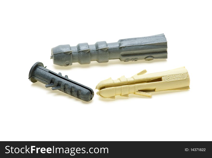 Three plastic dowels isolated on the white background