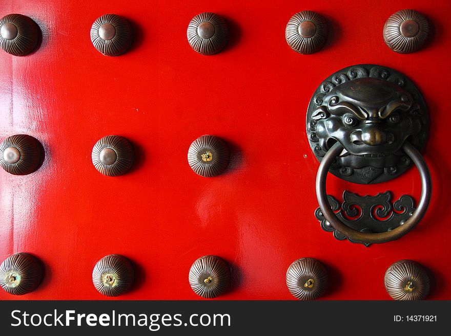 Asian door knocker with lion engraving