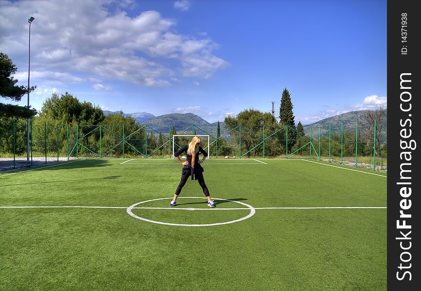 Girl on stadium in the park.