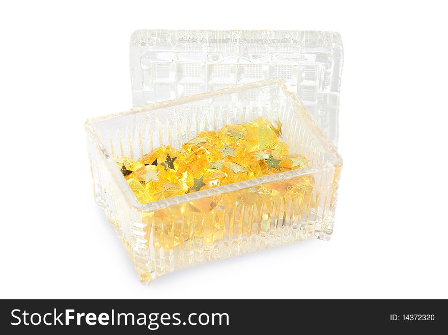 Small box with stars and yellow glass parts on the white