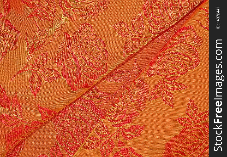 Shiny oramge fabric texture suitable as background. Shiny oramge fabric texture suitable as background