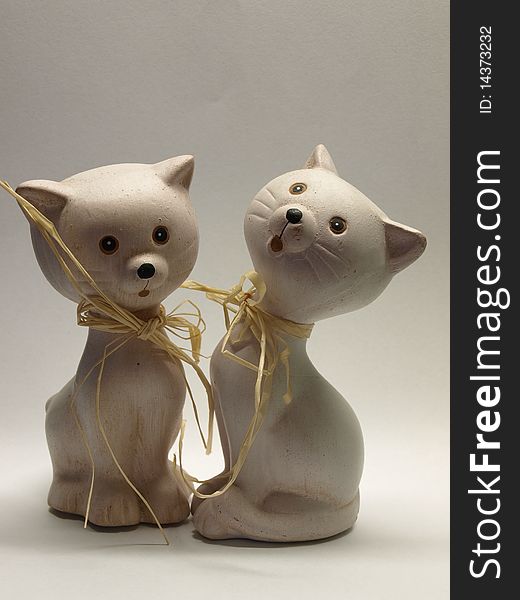 Two ceramic cat statue isolated on white background