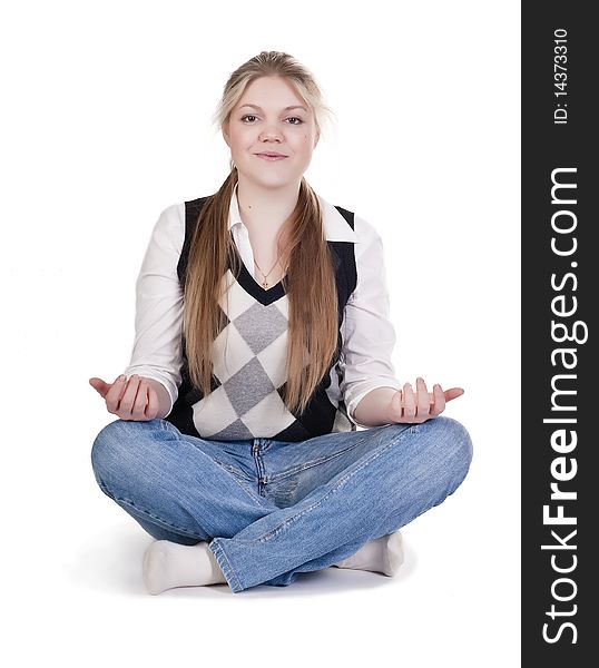 Pretty relaxed woman practicing yoga on a white background