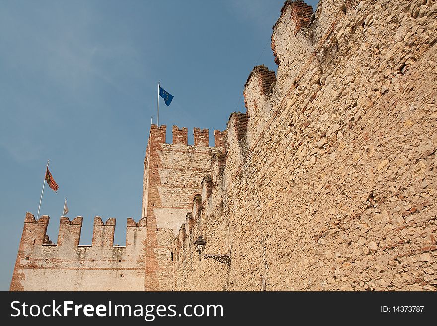 Castle wall in italy on blue sky