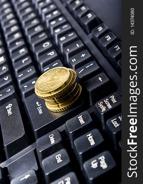 Line of coins on keyboard. Line of coins on keyboard