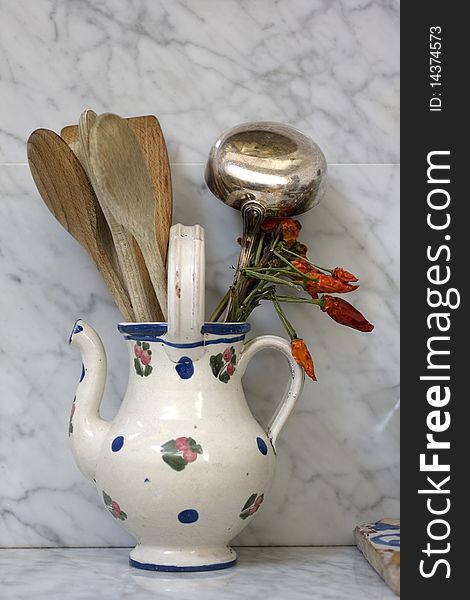 Cookware in a ceramic jug