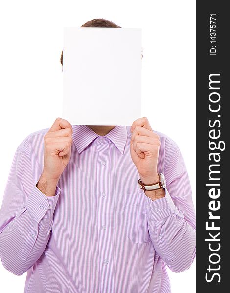 Young male adult holds a4 size copyspace in front of his face, isolated on white. Young male adult holds a4 size copyspace in front of his face, isolated on white