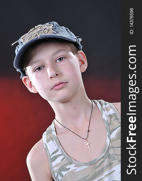 Portrait of is ten years old boy in a jean cap