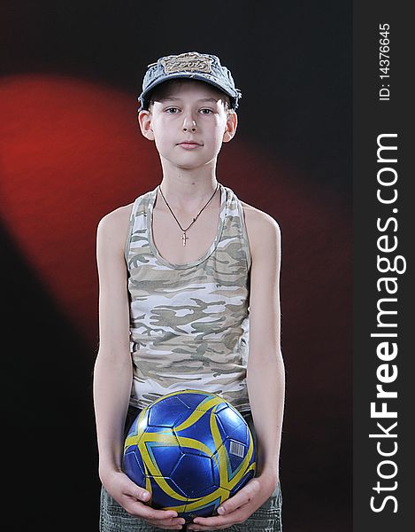 Boy of ten years with a ball