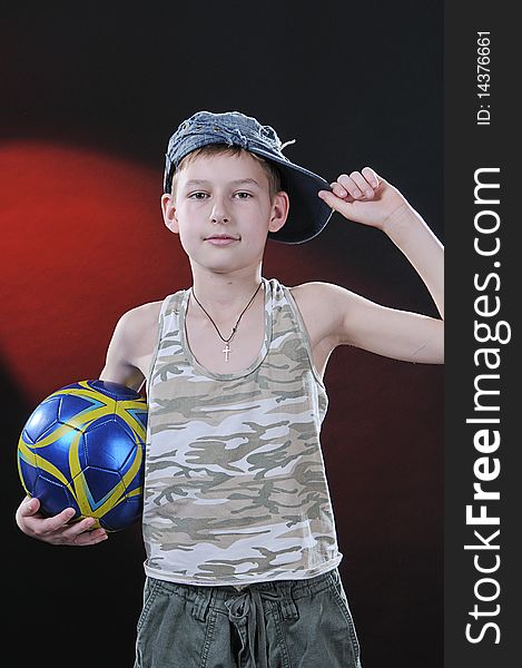 Boy of ten years with a ball