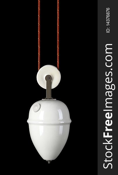 Porcelain lamp weight wich helps to lift up the chandelier, on isolated black background