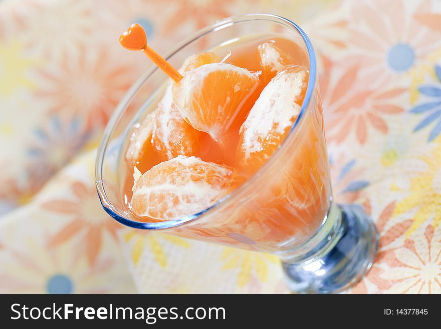 Tangerine cocktails with pieces of fruit