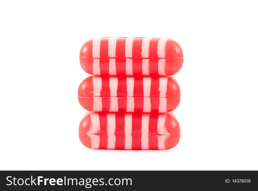 The stack of striped soaps isolated on white