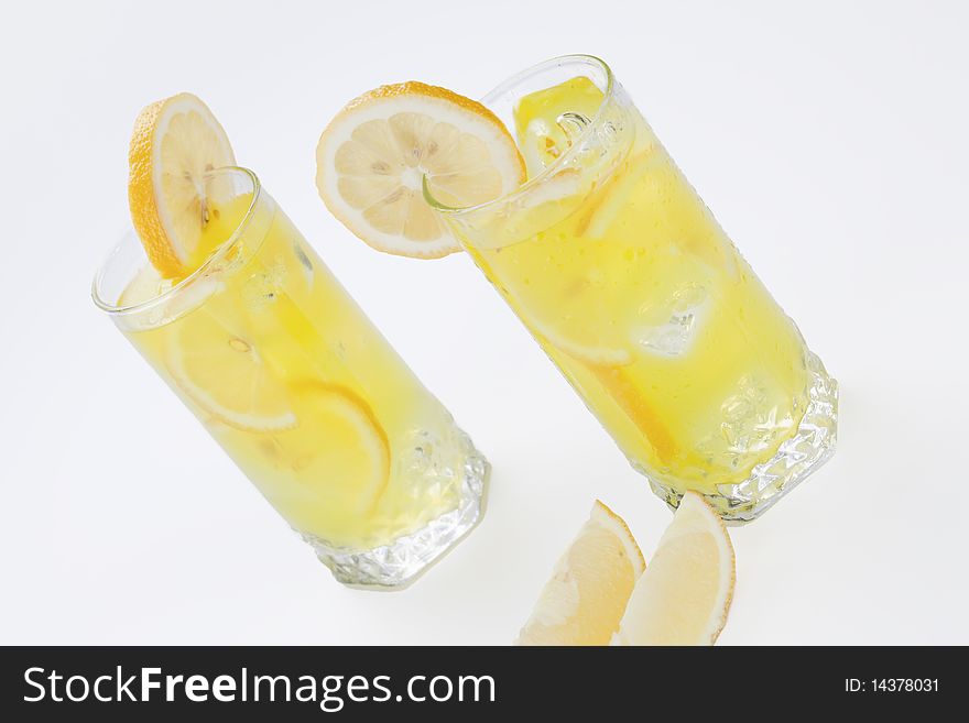 Cold lemon cocktails on white background