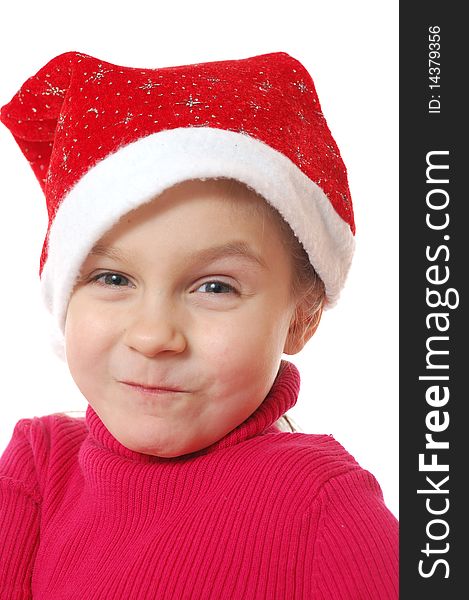 Funny Face Of Child Wearing Red Santaï¿½s Hubcap.