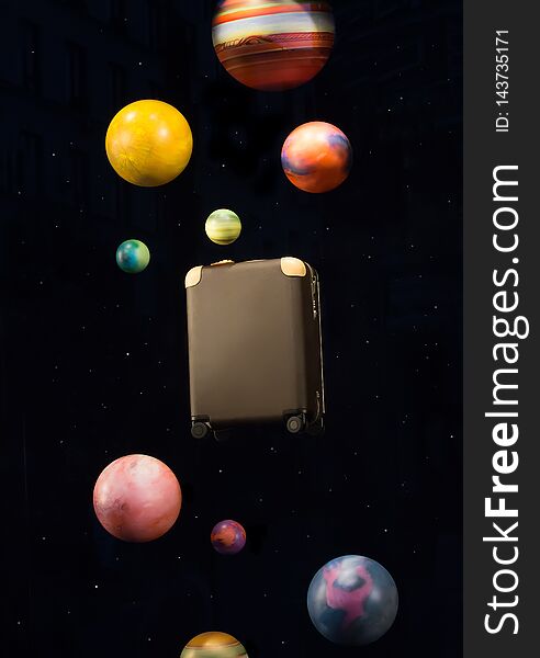 suitcase on the background of cosmic landscape with planets. Travel concept