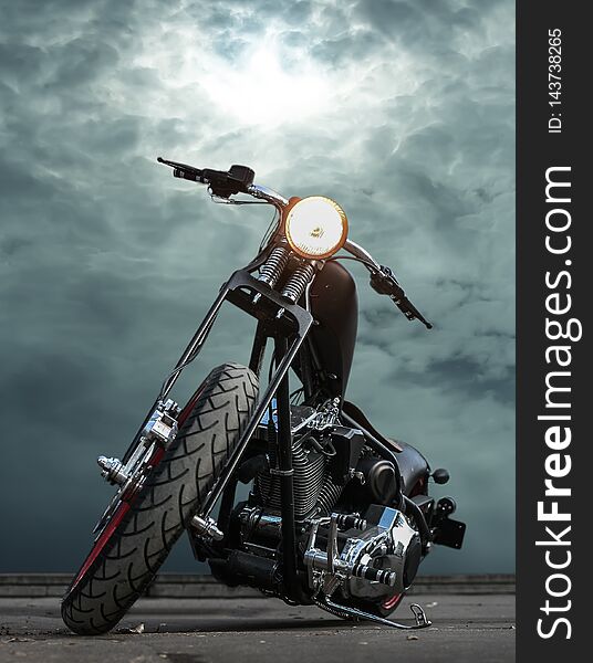 powerful motorcycle on asphalt against  sky