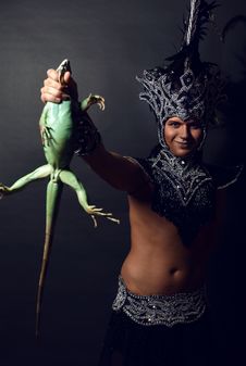 Pagan Priest In Ritual Suit With Green Iguana Stock Photo Pagan Priest In Ritual Suit With Green Iguana Stock Photo