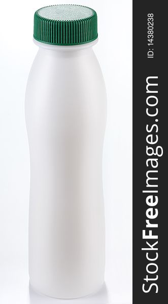 Plastic bottle of milk on a white background