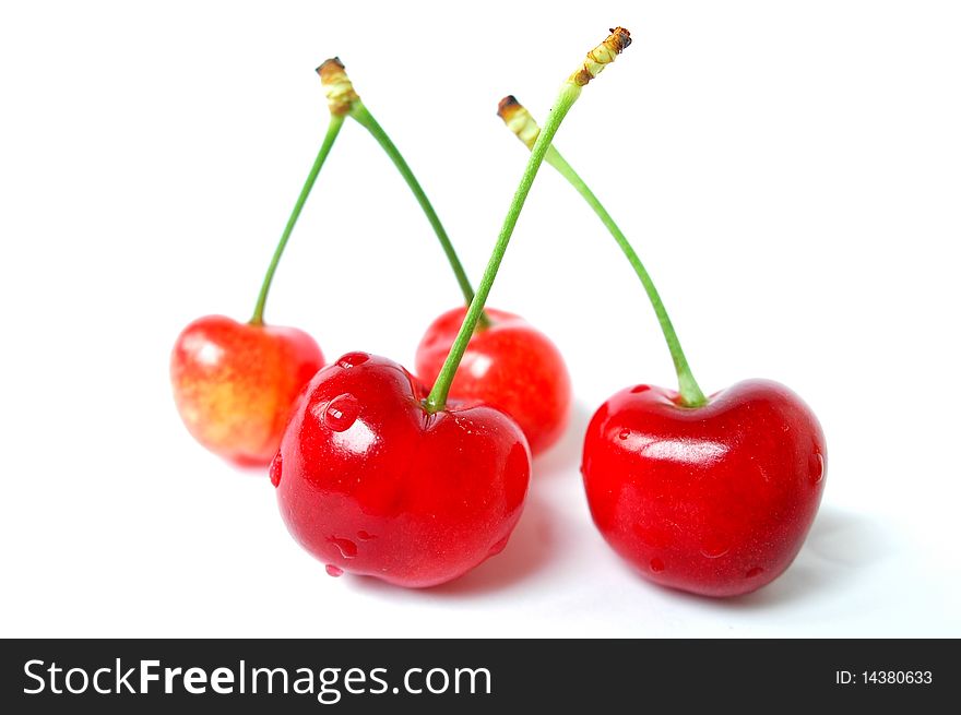 Fresh red cherry fruits isolated on a white background