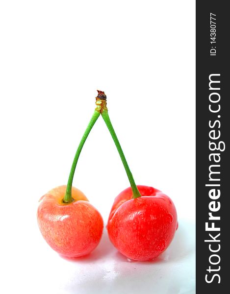 Fresh red cherry fruits isolated on a white background