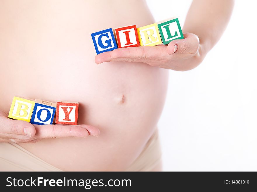 Pregnant belly with wooden toy blocks. Pregnant belly with wooden toy blocks