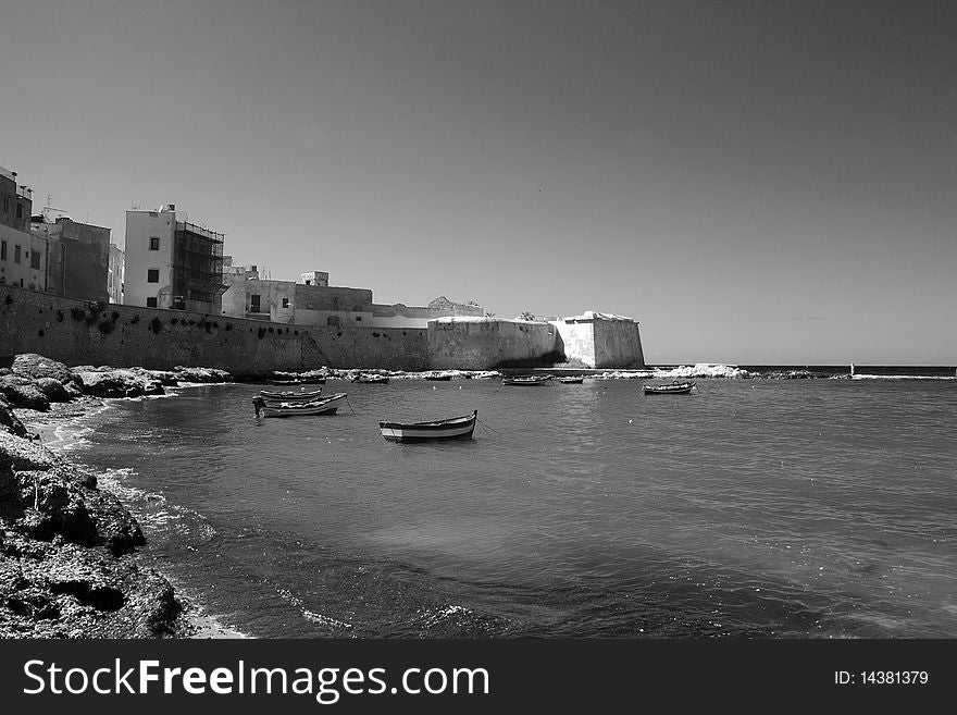 Long sea drilling vessel on the horizon between the ancient bastion. Long sea drilling vessel on the horizon between the ancient bastion