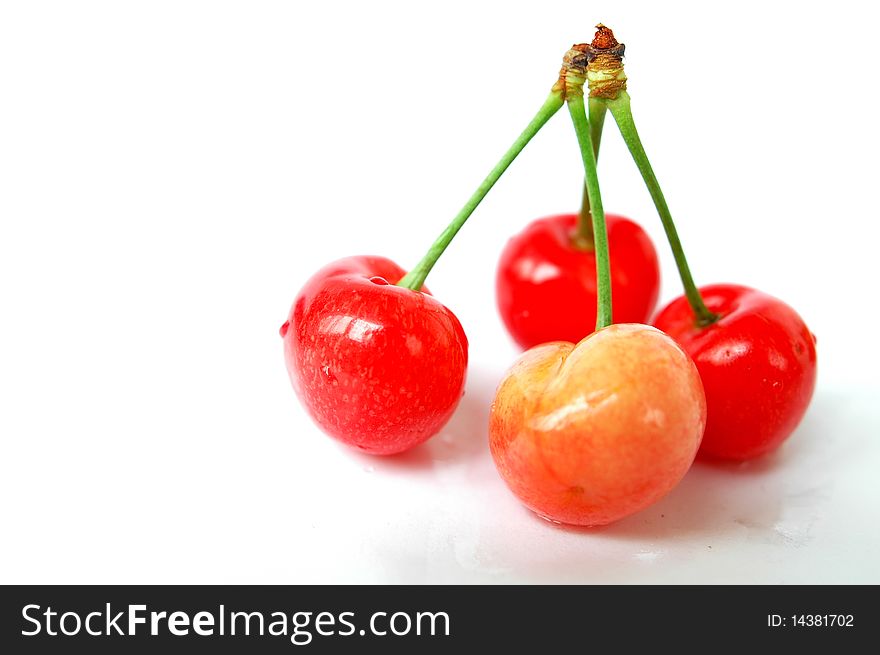 Fresh red cherry fruits isolated on a white background