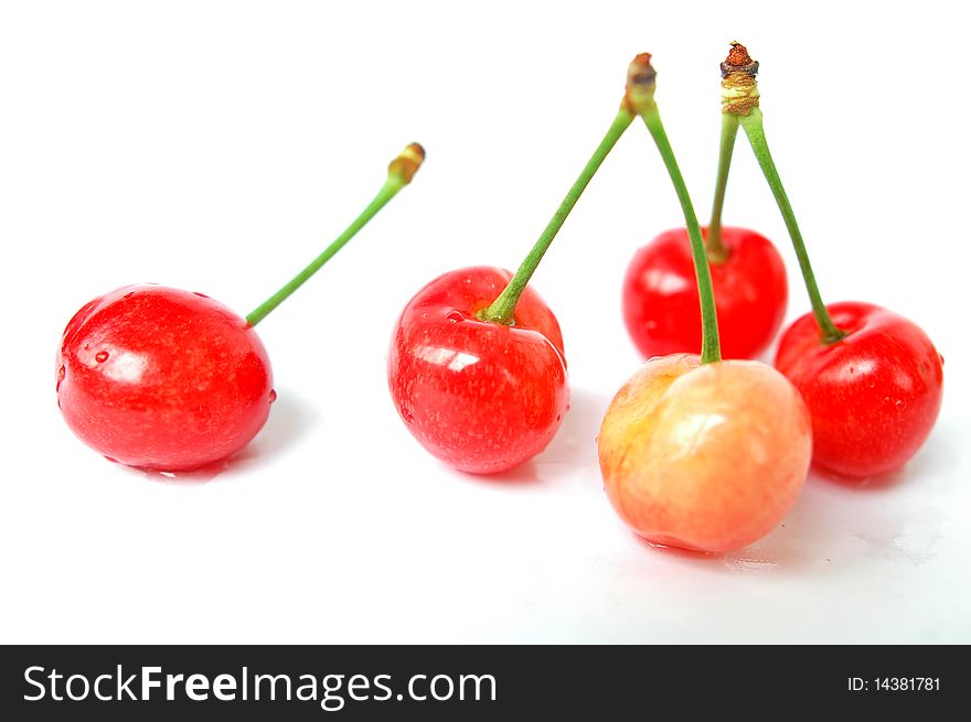 Fresh red cherry fruits isolated on a white background