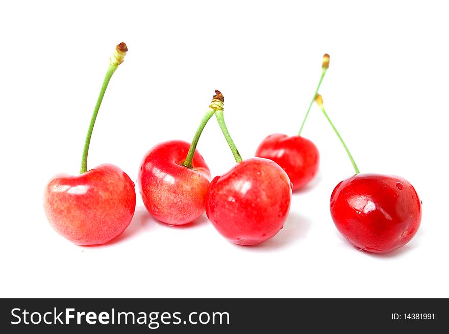 Fresh red cherry fruits isolated on a white background