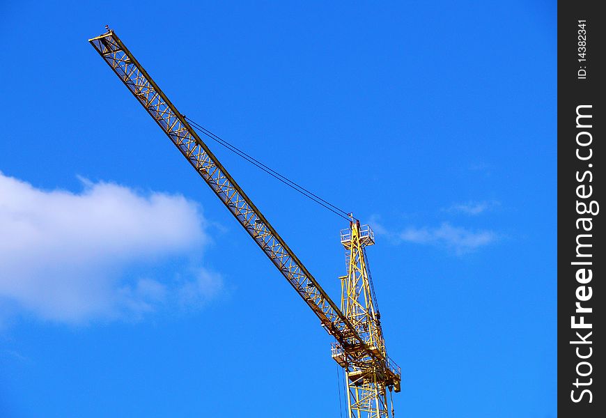 Crane on background blue sky with clouds. Crane on background blue sky with clouds