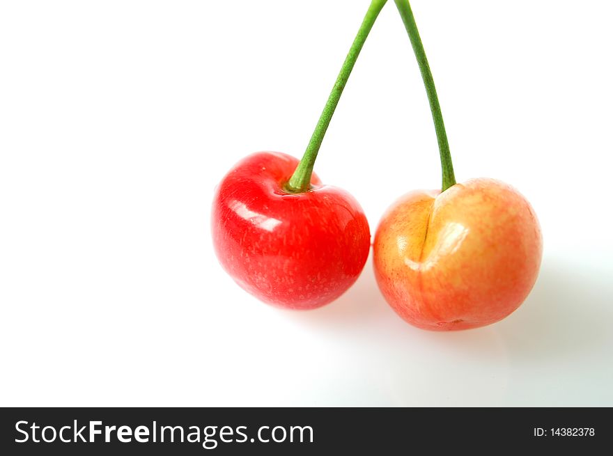 Fresh red cherry fruits isolated on a white background