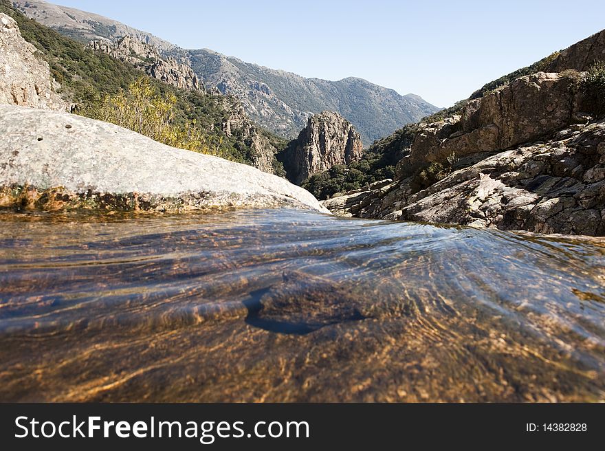 Water flowing on a rocky mountain. Water flowing on a rocky mountain