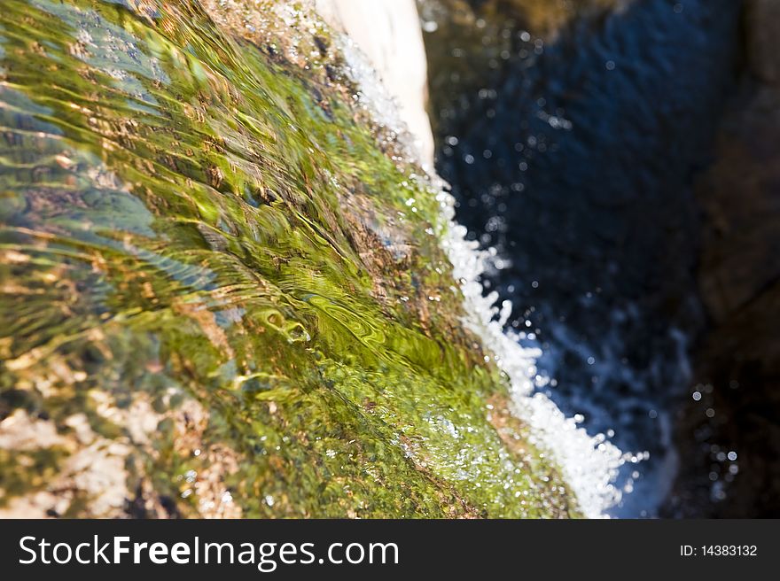 Water flowing on a rocky mountain. Water flowing on a rocky mountain
