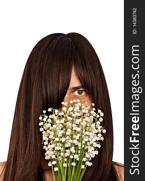 Woman smelling bouquet of lilies of the valley