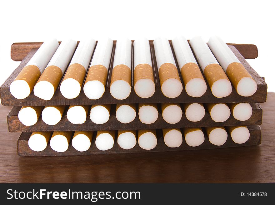 It is a lot of cigarettes on a support on a white background bad