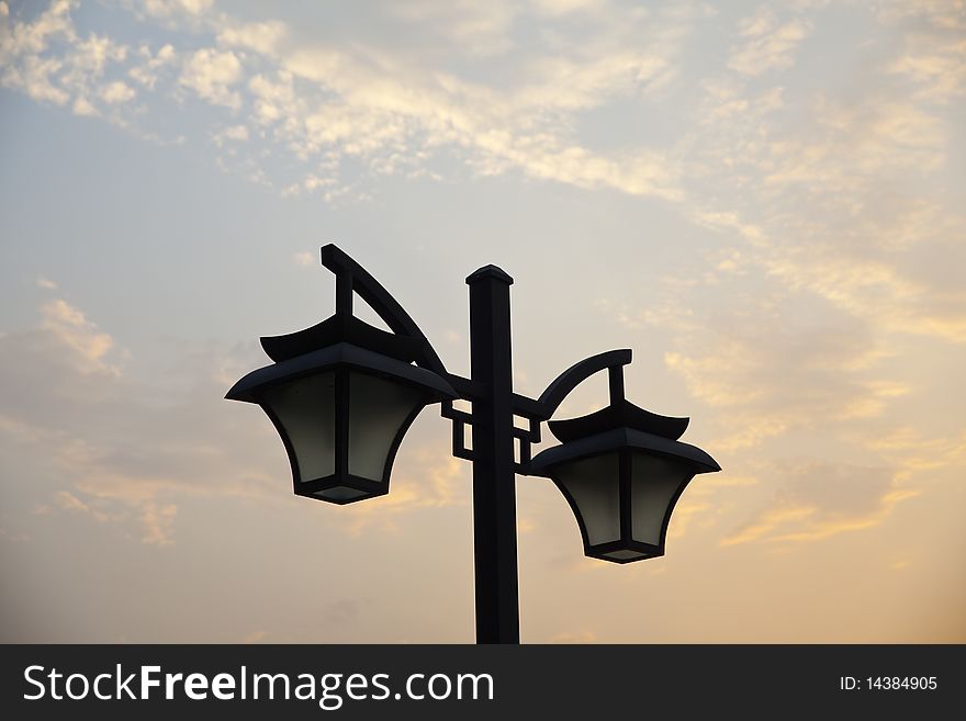 The street lamps in the dusk