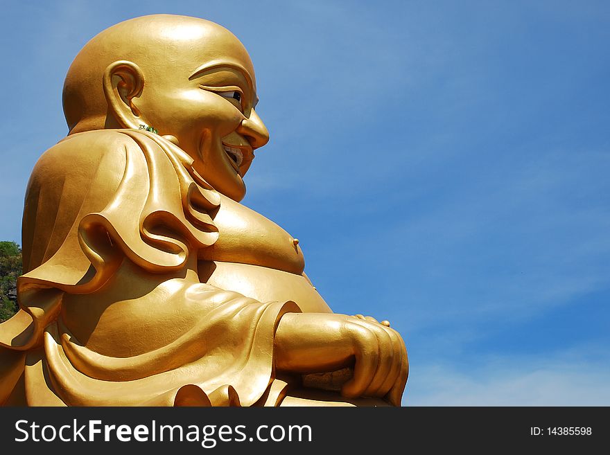 Big Buddha image and blue sky.