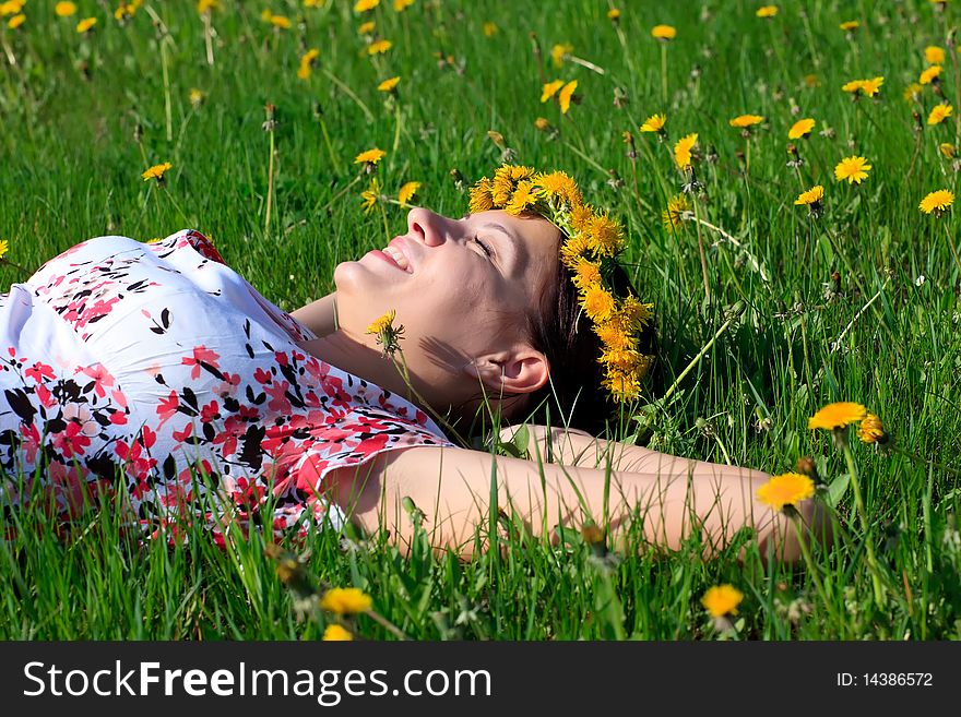 Beautiful girl lying down of grass