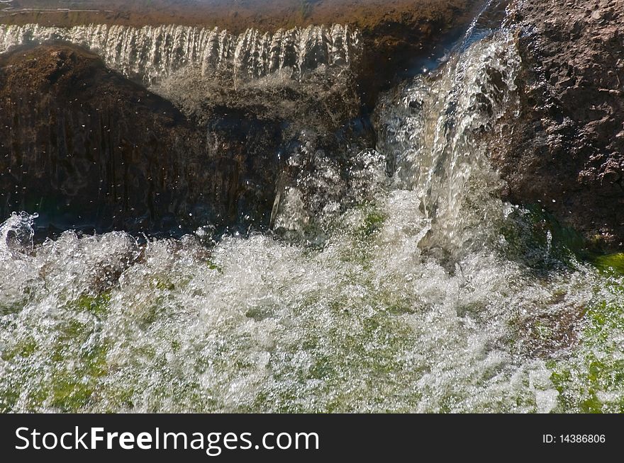 Fast rough falls of the river in the spring