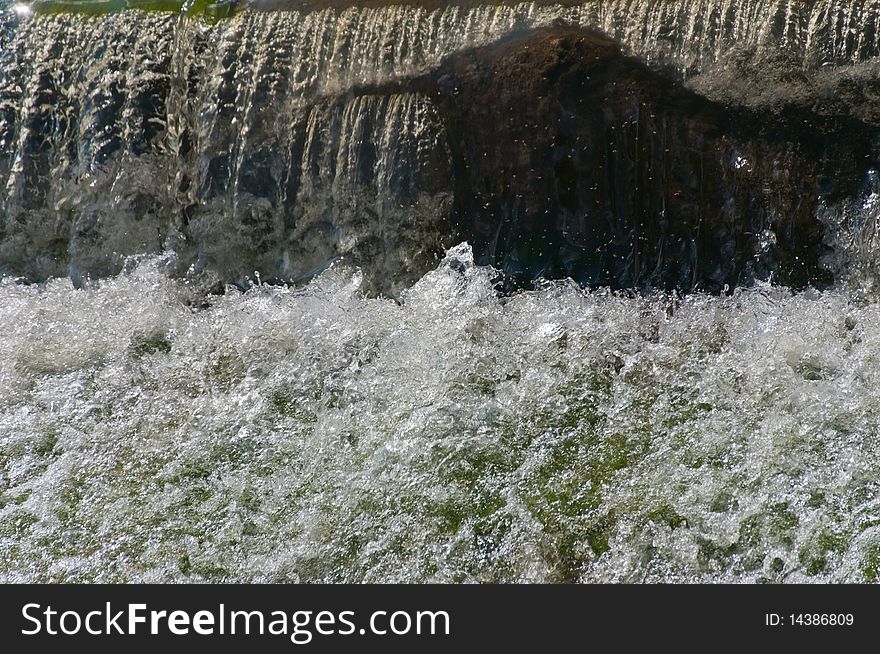 Fast rough falls of the river in the spring