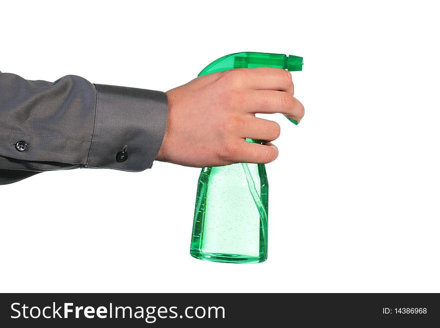 The man's hand holds a spray for water dispersion.