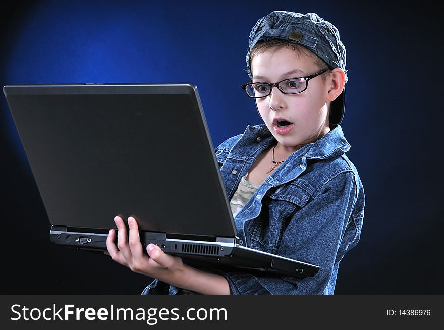 Boy of ten years is led away a game on the computer. Boy of ten years is led away a game on the computer