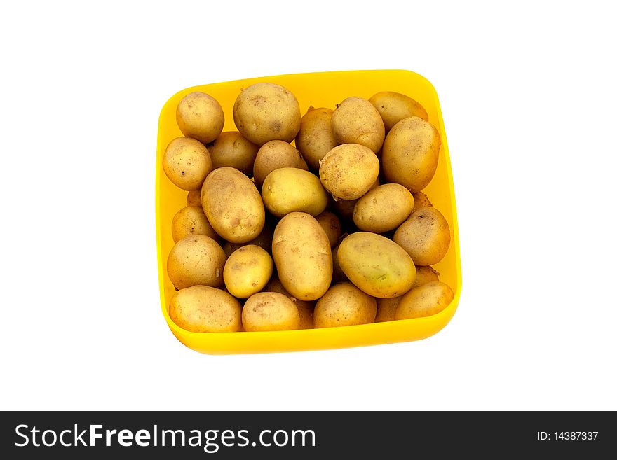 Potatoes in a yellow bowl Isolated on white background