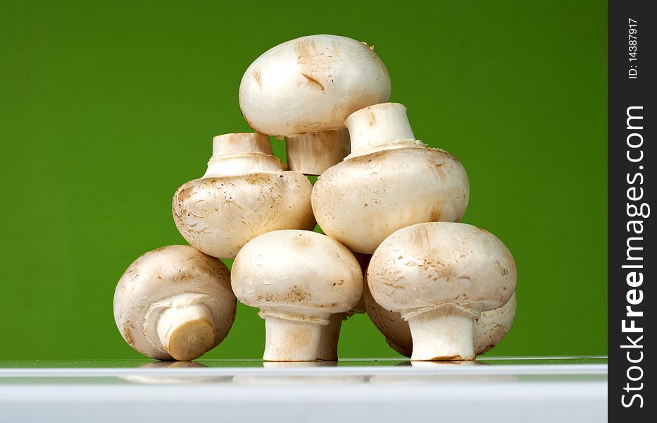 Fresh Mushrooms On A White Table