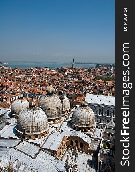 A sky line or aerial view of the roof tops over Venice with domes and traditional roof tops. A sky line or aerial view of the roof tops over Venice with domes and traditional roof tops.