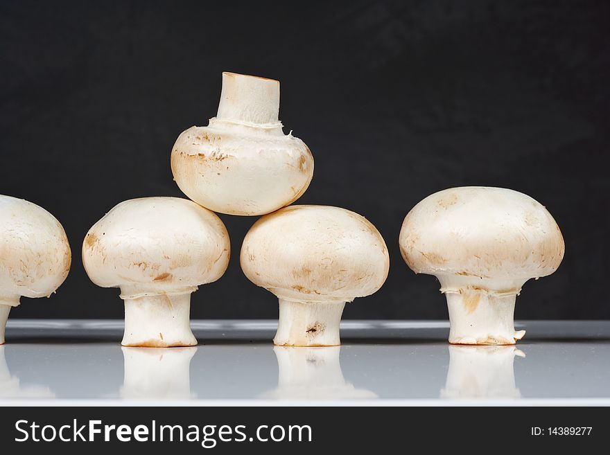 Fresh Mushrooms On A White Table