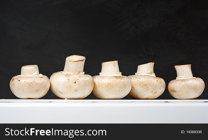 Fresh Mushrooms On A White Table