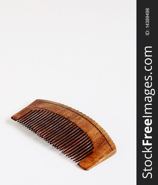 A wooden comb isolated on white background